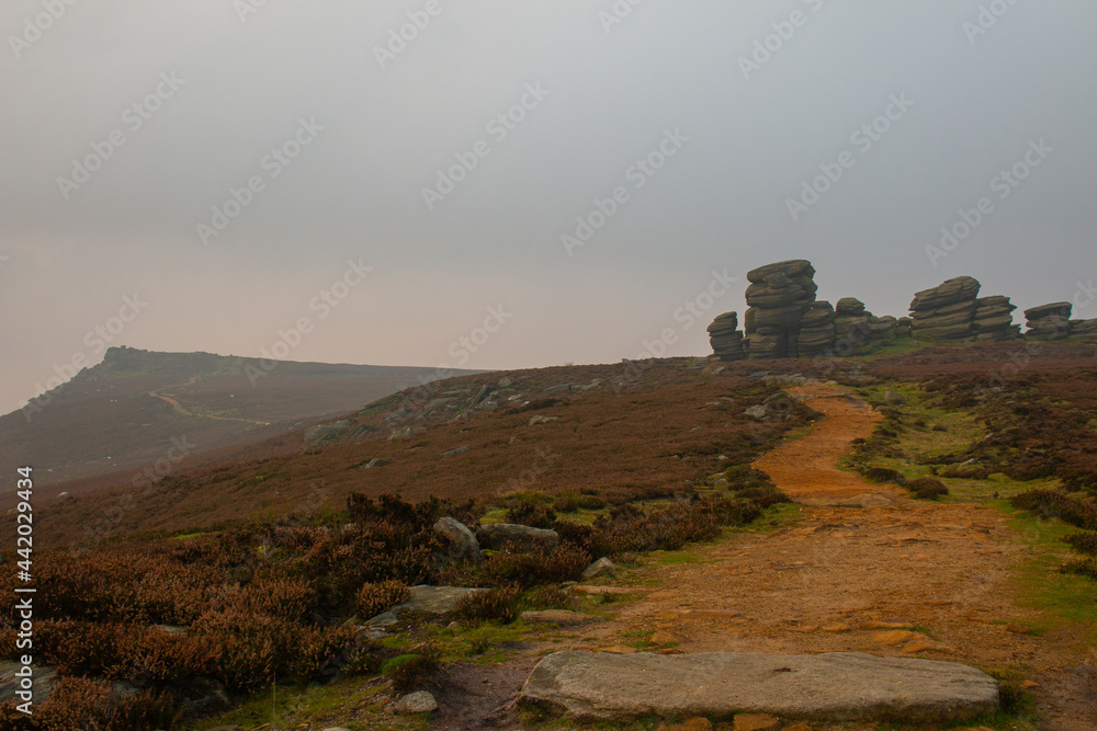 The hiking trail around Ladybower Reservoir at sunset in the fog, Peak District, Derbyshire, England The hiking trail around Ladybower Reservoir at sunset in the fog, Peak District, Derbyshire, England