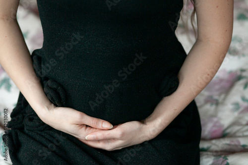 woman holding her belly