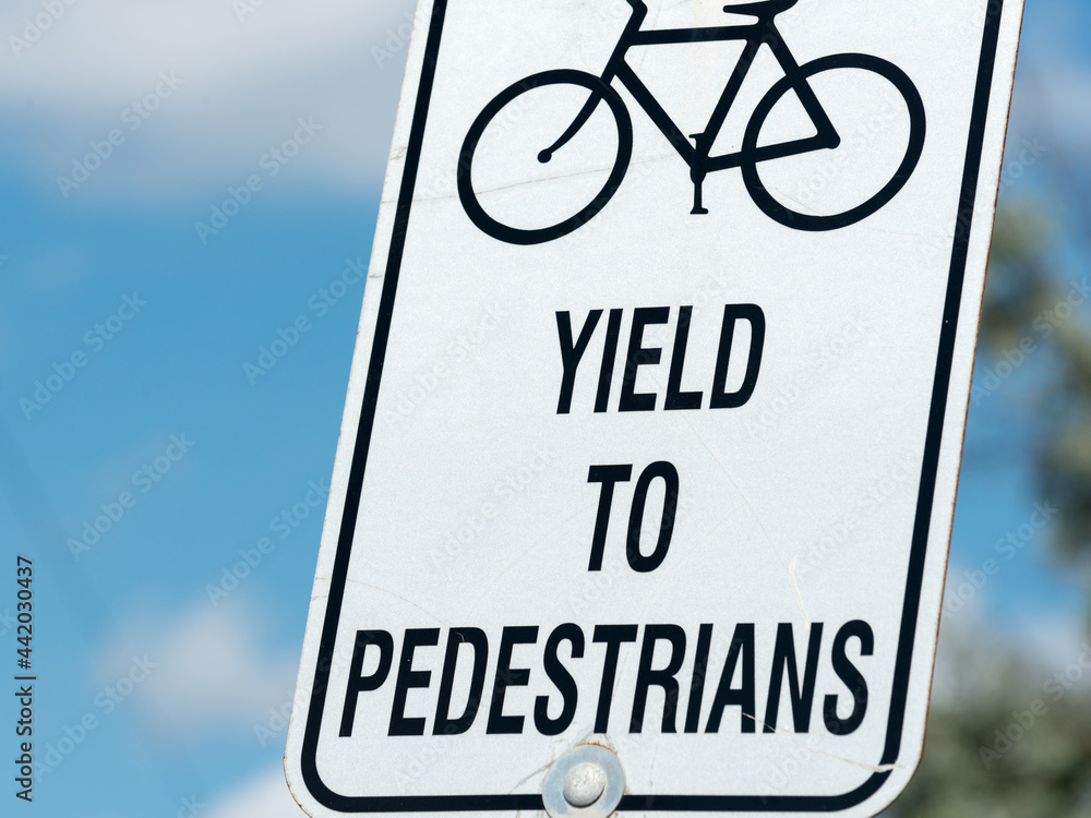 bicycle lane sign - or sign informing cyclists to yield to pedestrians bicycle lane sign - or sign informing cyclists to yield to pedestrians