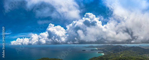 aerial view three beaches viewpoint in blue sky. .The popular landmark to see three beaches.Kata Noi beach Kata beach and Karon beach..aerial panorama view white cloud in blue sky cover the blue sea