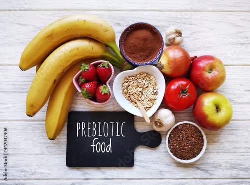 Assortment of foods high in prebiotics for healthy gut and digestive system. Prebiotics rich foods to aid digestion and gut health. Natural food sources of prebiotics for good gut bacteria.