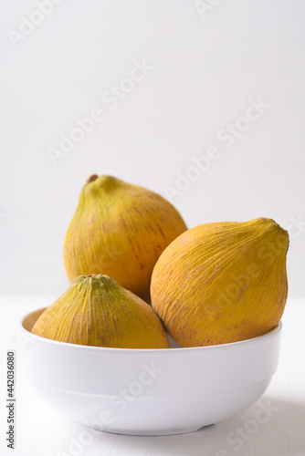 Ripe santol fruit on white background, tropical fruit mostly in Southeast Asia, refreshing and healthy eating sweet taste