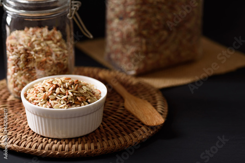 Organic brown rice harvested from the fields of northern Thailand. Rich in vitamins and fiber, which are beneficial to health. natural product concept photo