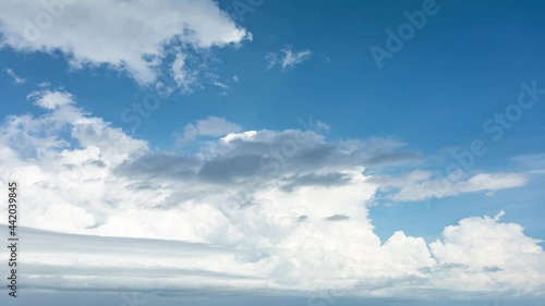 4K. Time-lapse fluffy cloud, moving on blue sky background, 4K. Time-lapse, Beautiful blue sky, with cloudy on a sunny day, Summer cloud video time-lapse, on blue sky background.