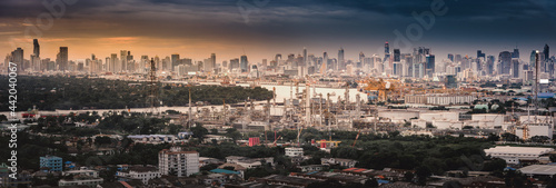 City Landscape and Oil Refinery Petrochemical Manufacturing Plant at Twilight Sunset Scenic, Industrial of Power Energy and Chemical Petroleum Product Factory With Cityscape Scenery. Heavy Industry