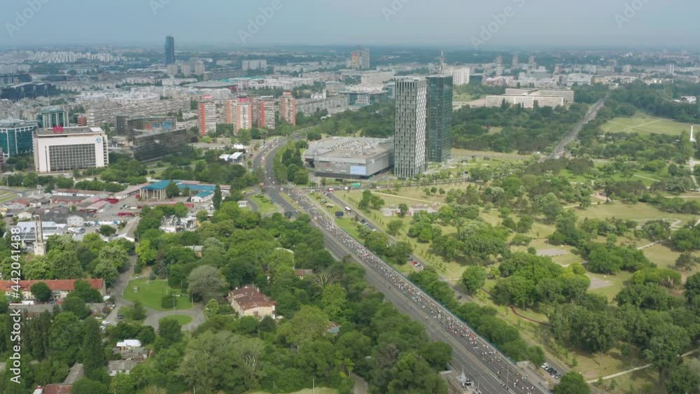 Panorama Of Athletes Running At Bulevar Mihajla Pupina During Belgrade Marathon In Serbia aerial, pullback Panorama Of Athletes Running At Bulevar Mihajla Pupina During Belgrade Marathon In Serbia aerial, pullback