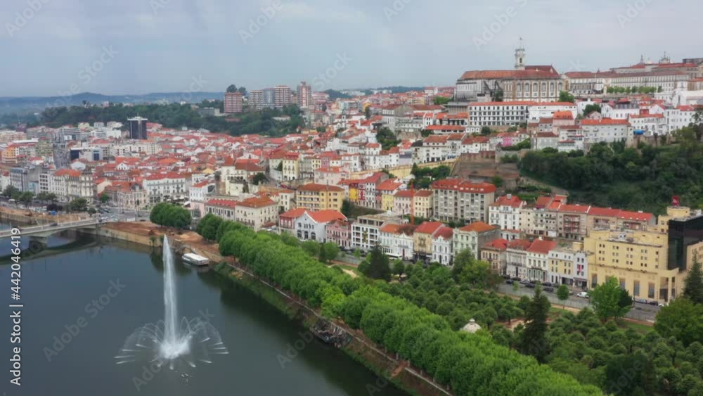 Aerial drone shot showing beautiful medieval city of Coimbra beside Rio Mondego in Portugal Aerial drone shot showing beautiful medieval city of Coimbra beside Rio Mondego in Portugal