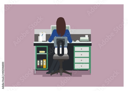 Female office employee working, backside view