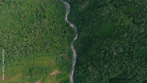 Cenital view of the river in middle of the jungle in cusco Peru photo