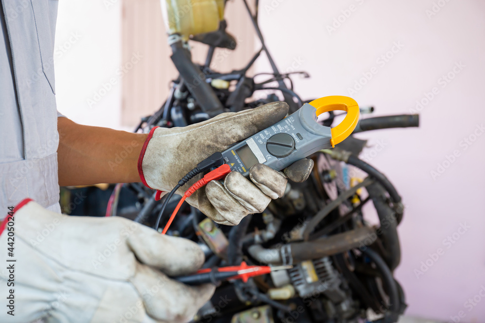Auto mechanic working in mechanics garage, Technician checking a car engine, Repair and Maintenance service Auto mechanic working in mechanics garage, Technician checking a car engine, Repair and Maintenance service
