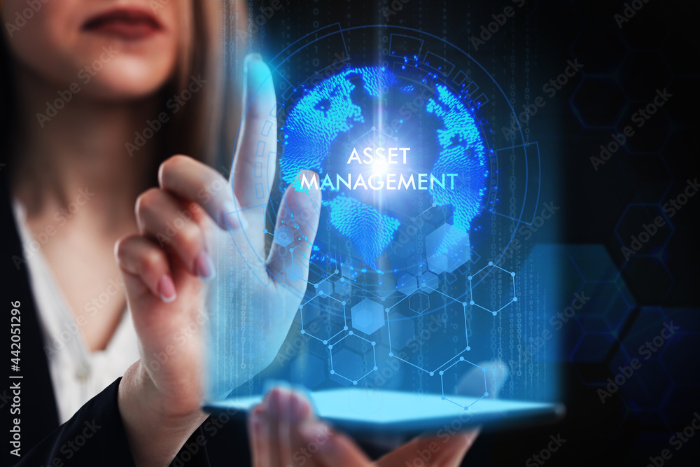 Business, Technology, Internet and network concept. Young businessman working on a virtual screen of the future and sees the inscription: Asset management Business, Technology, Internet and network concept. Young businessman working on a virtual screen of the future and sees the inscription: Asset management