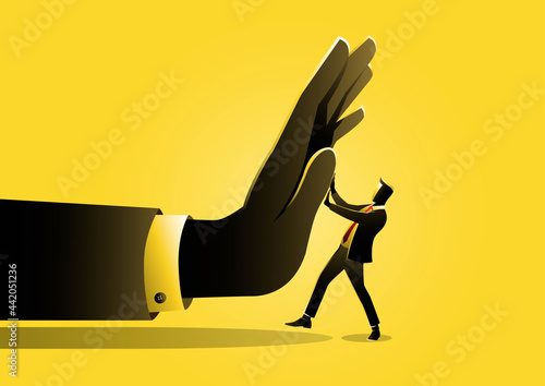 A businessman being pushed by giant hand