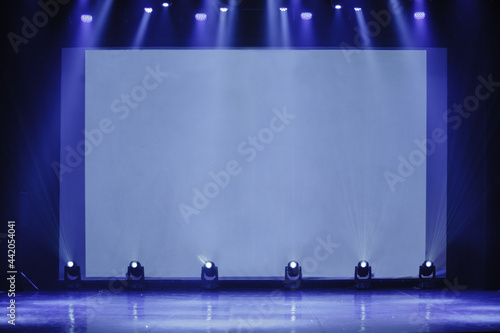 Business and Entrepreneurship concept. conference hall at business event. empty stage. Focus on the stage. blue toning photo. empty stage with a screen for the proctor, waiting for the start of the