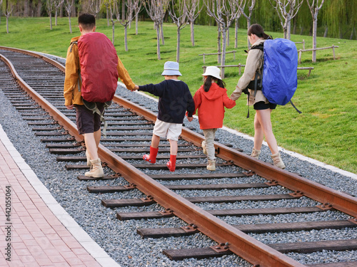 A Happy family of four outdoor hiking