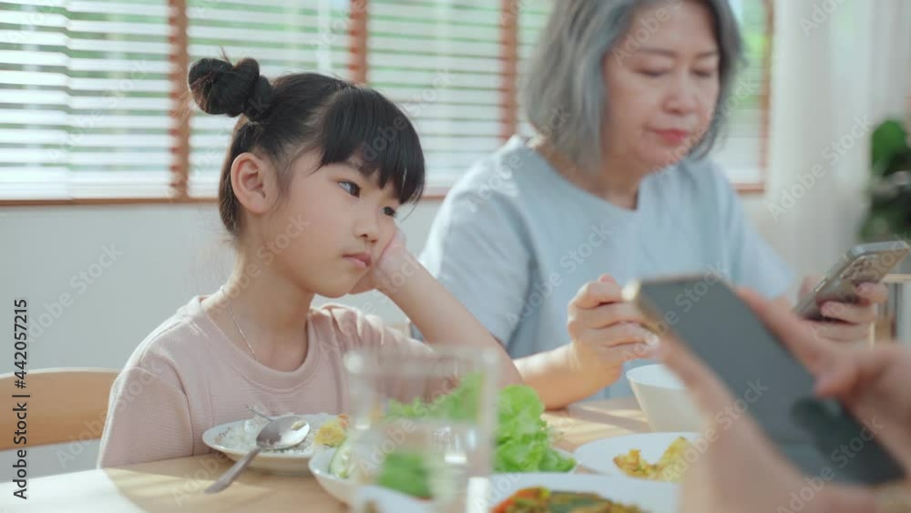 Asian girl getting problem from phone or internet addiction of family. Asian girl getting problem from phone or internet addiction of family.
