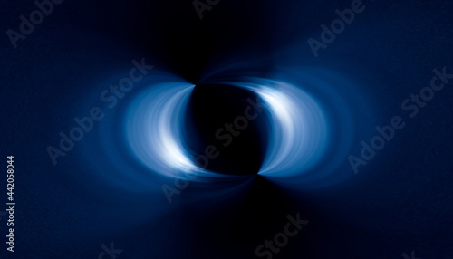 blue light rays in symmetry and abstract form over a black background
