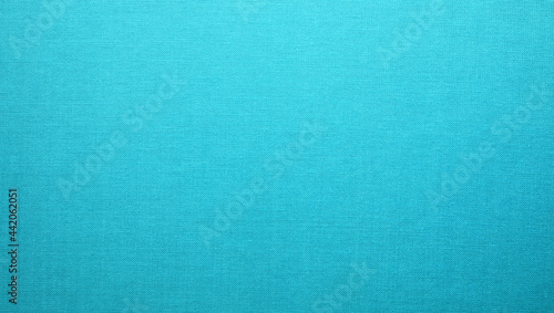 Turquoise blue cloth texture background. Simple pattern textile surface closeup