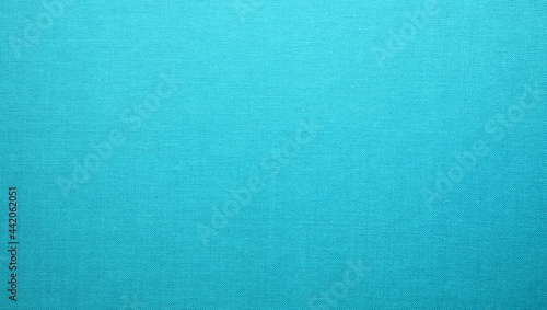 Turquoise blue cloth texture background. Simple pattern textile surface closeup