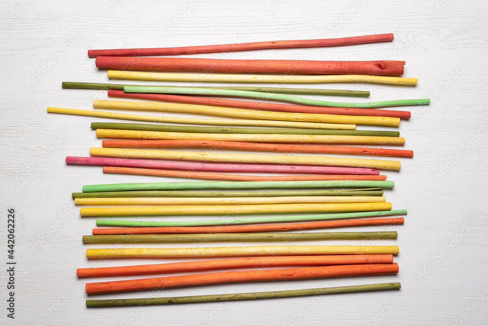 Colorful aroma sticks on the white flat lay background. Colorful aroma sticks on the white flat lay background.