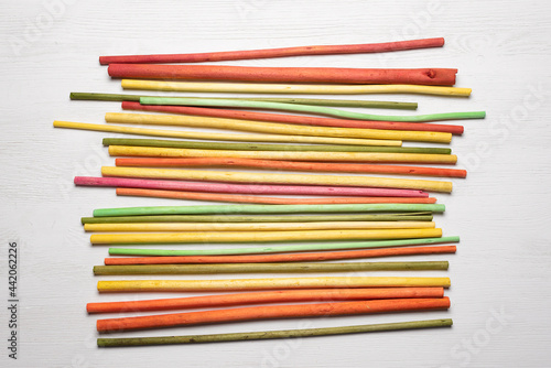 Colorful aroma sticks on the white flat lay background. photo