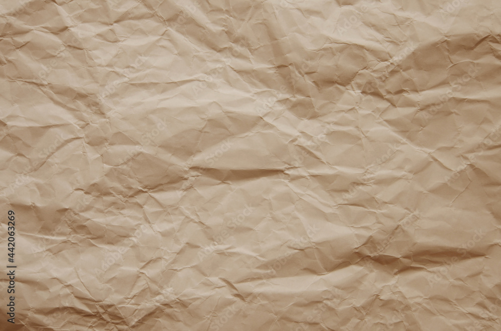Texture of crumpled imitation craft paper. Recycle old brown paper background Texture of crumpled imitation craft paper. Recycle old brown paper background
