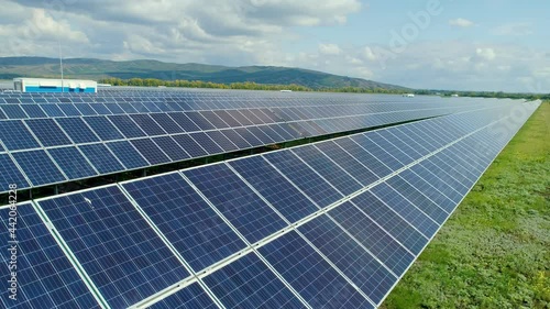 Autonomous solar station, silent work. Photolectric cell panel close-up. The sun evenly illuminates the panels. High quality. 4k footage.
