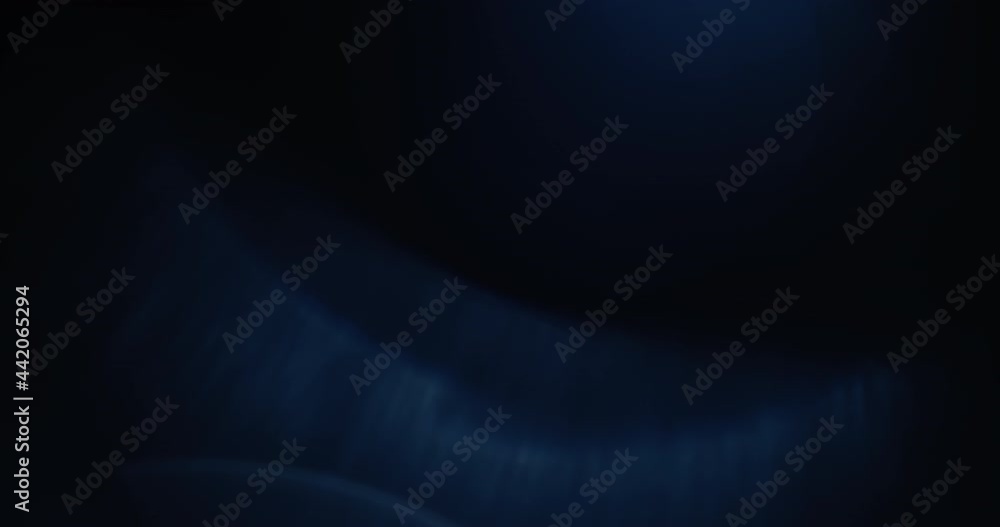 Beautiful overlays of blue lens flares glowing on the black background. Slow motion. Beautiful overlays of blue lens flares glowing on the black background. Slow motion.