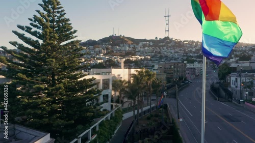 Aerial: Giant rainbow flag flapping in the wind. Castro, San Francisco, USA