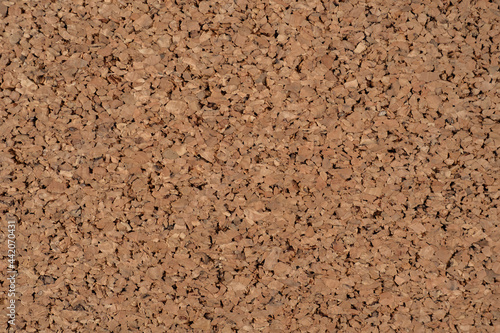 Cork board textured background. Brown wood background. Textured wooden background. Cork board with copy space. Notice board or bulletin board image. Construction and finishing materials.