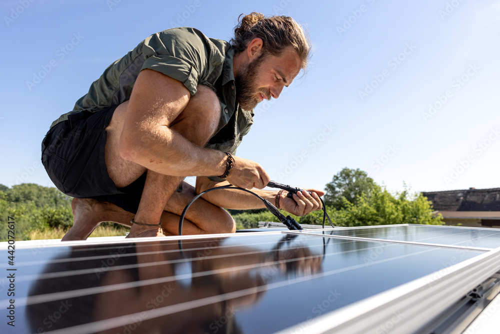 Man connecting a solar panel