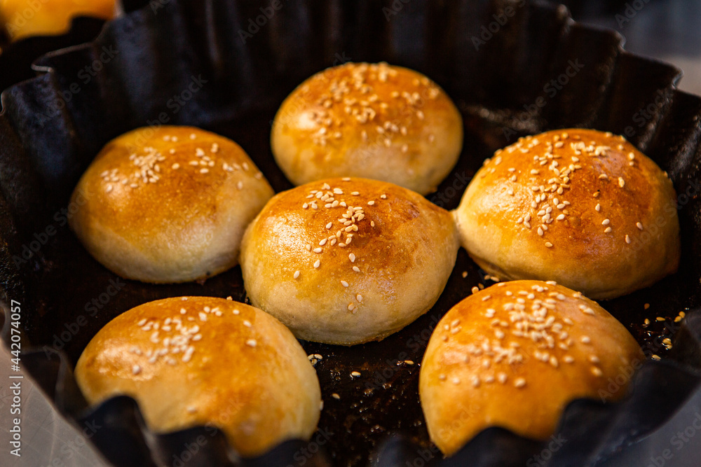 Fresh homemade bread taken from the wood oven. Close up of rustic whole meal bread rolls Fresh homemade bread taken from the wood oven. Close up of rustic whole meal bread rolls