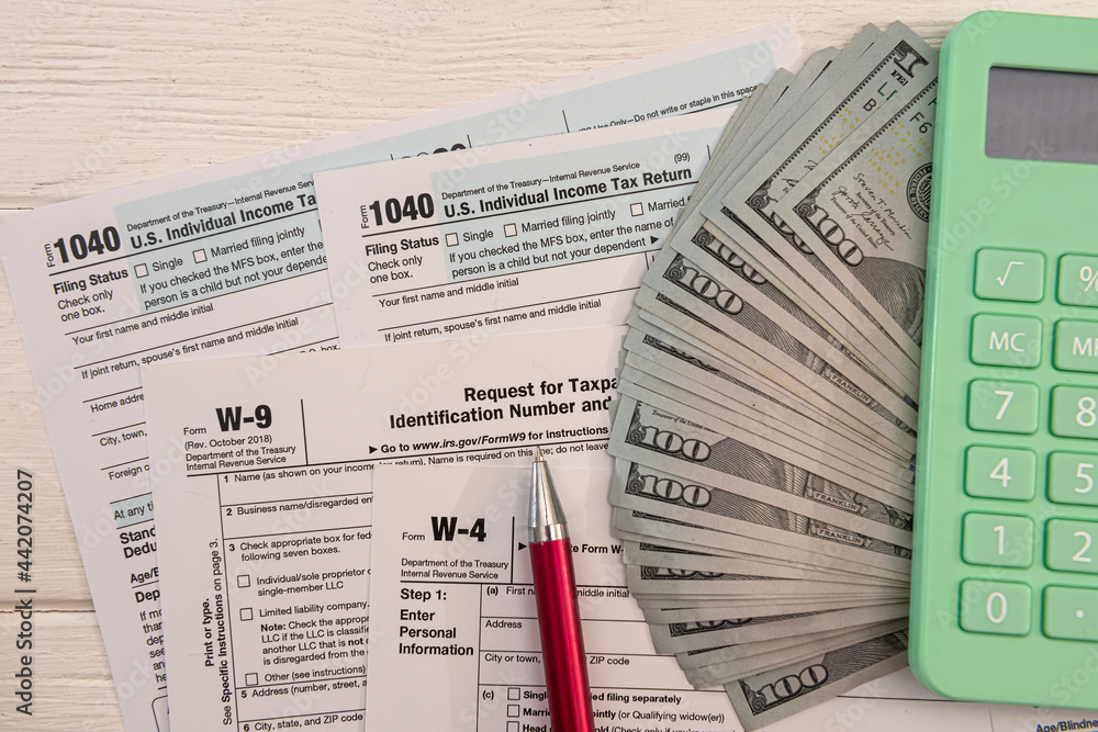 Naklejka premium 1040 individual form, with us money. Tax time concept