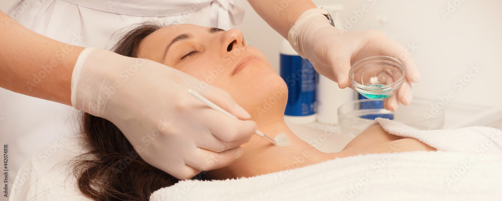 Photo of young woman at cosmetologist treatment Photo of young woman at cosmetologist treatment
