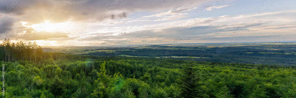 Panoramic view to forest summer Czech valley landscape with small vilage Besednice at sunset cloudy sky Panoramic view to forest summer Czech valley landscape with small vilage Besednice at sunset cloudy sky