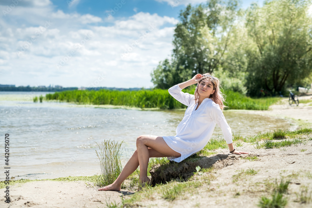 young beautiful woman in white dress enjoy nature near the lake, freedom young beautiful woman in white dress enjoy nature near the lake, freedom