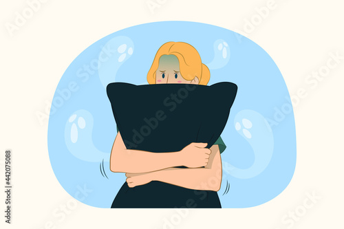 Young scared girl hug pillow concept