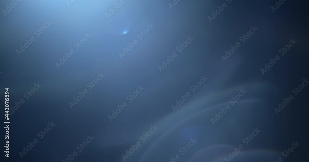 A pack of four blue lens flares and light leaks overlays in slow motion. 