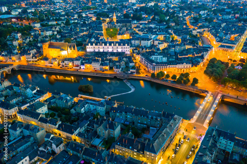 Evening aerial view of the city of Laval and the Mayenne river. France