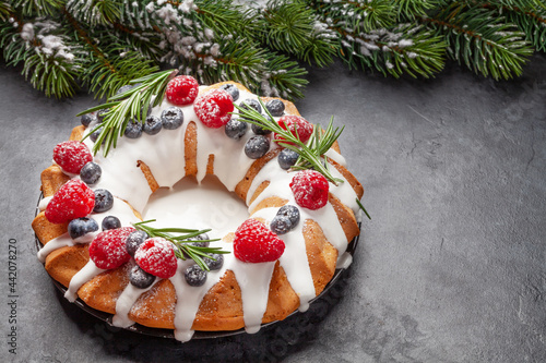 Christmas cake with berries and fir tree © karandaev