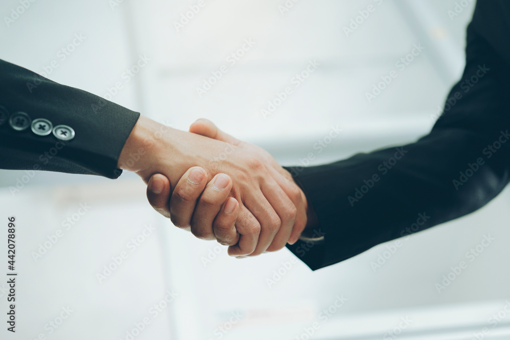 Businessmans handshake after good deal. Businessmans handshake after good deal.