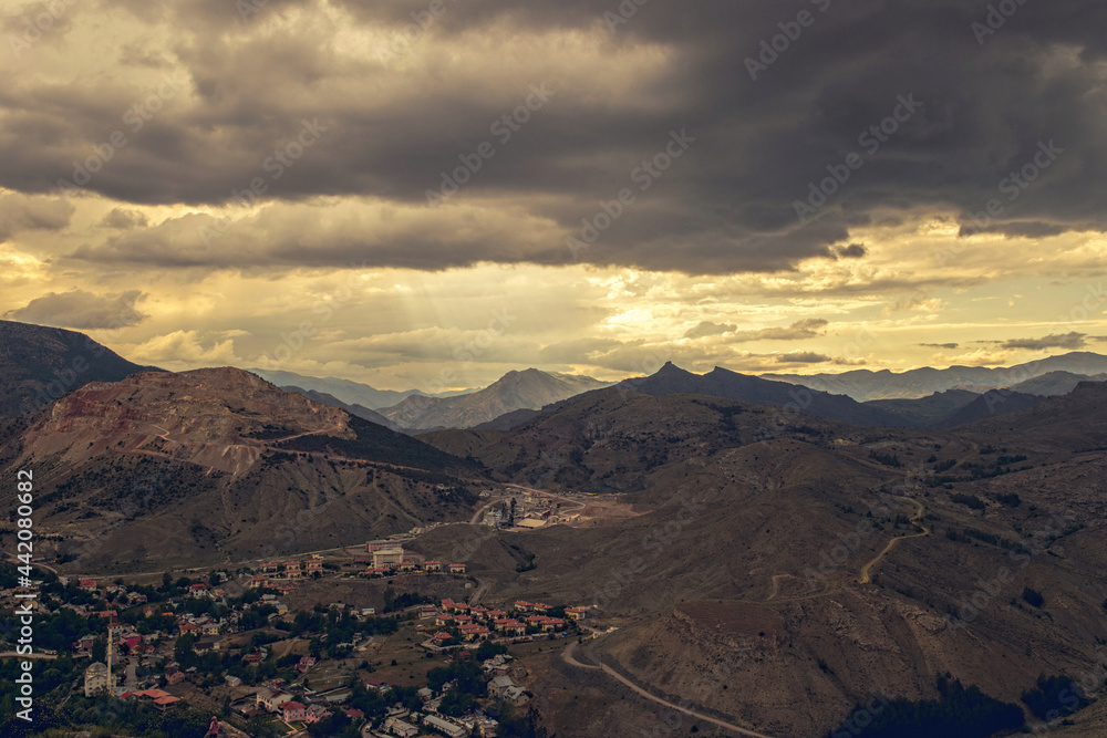 Sun rays and desert mountains. Landscape in the middle east