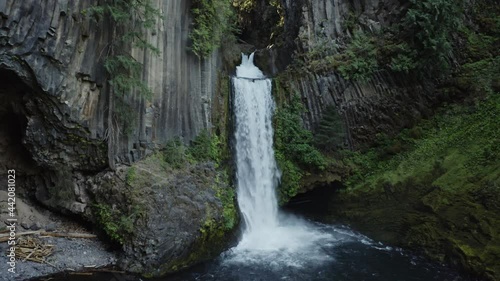 Wide drone shot pushing in on Toketee Falls, Oregon. photo