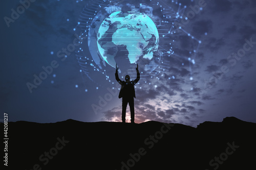 Fototapeta Naklejka Na Ścianę i Meble -  Backlit businessman holding glowing earth hologram on dark night city background. Global community and digital transformation concept.