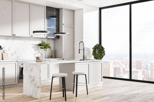 Fotografia Contemporary kitchen interior with island, appliances, sunlight and city view