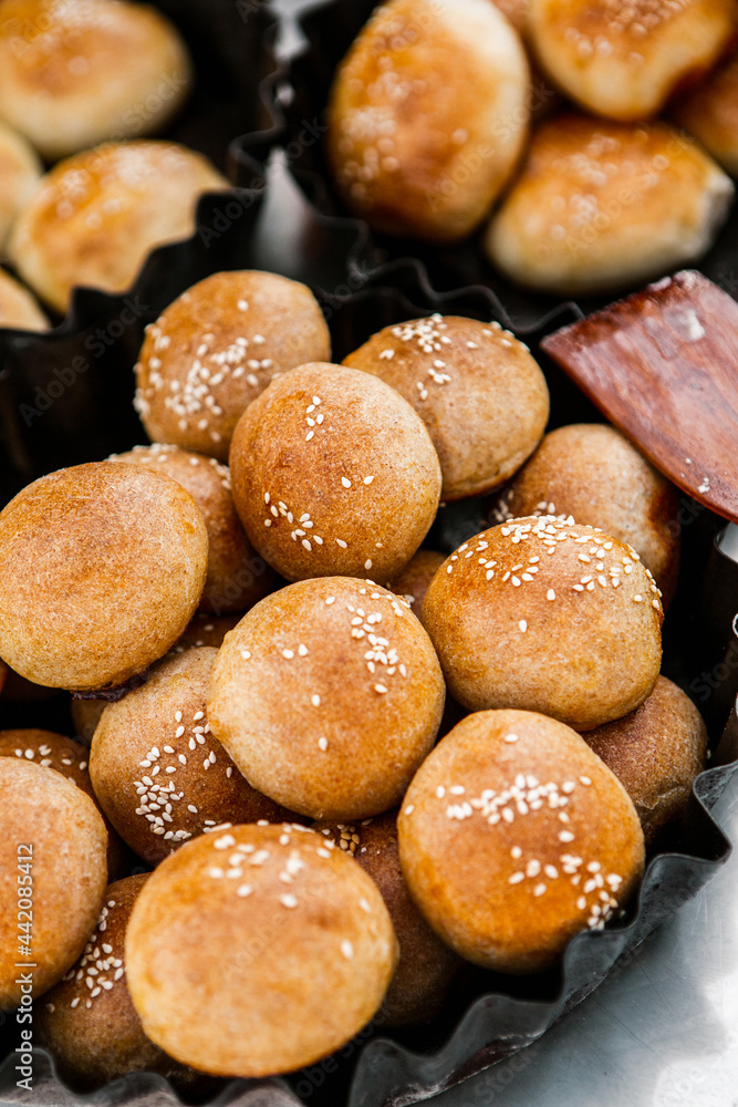 Fresh homemade bread taken from the wood oven. Close up of rustic whole meal bread rolls Fresh homemade bread taken from the wood oven. Close up of rustic whole meal bread rolls