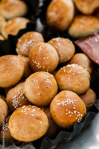 Fresh homemade bread taken from the wood oven. Close up of rustic whole meal bread rolls