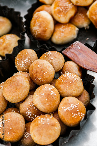 Fresh homemade bread taken from the wood oven. Close up of rustic whole meal bread rolls