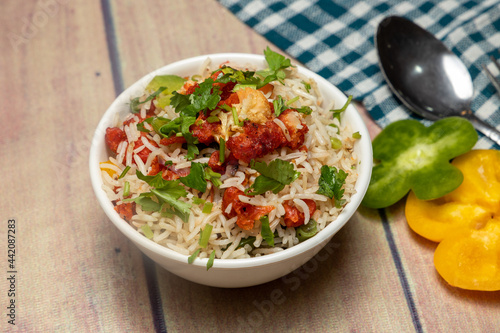 gobi fried rice with capsicum and coriander on top