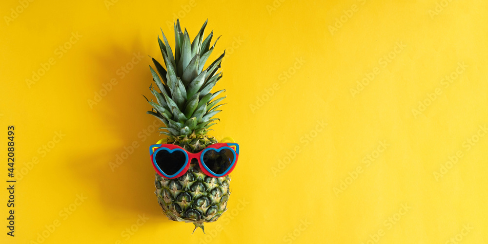 Pineapple hipster in sunglasses. Minimal concept, summer tropical pineapple.