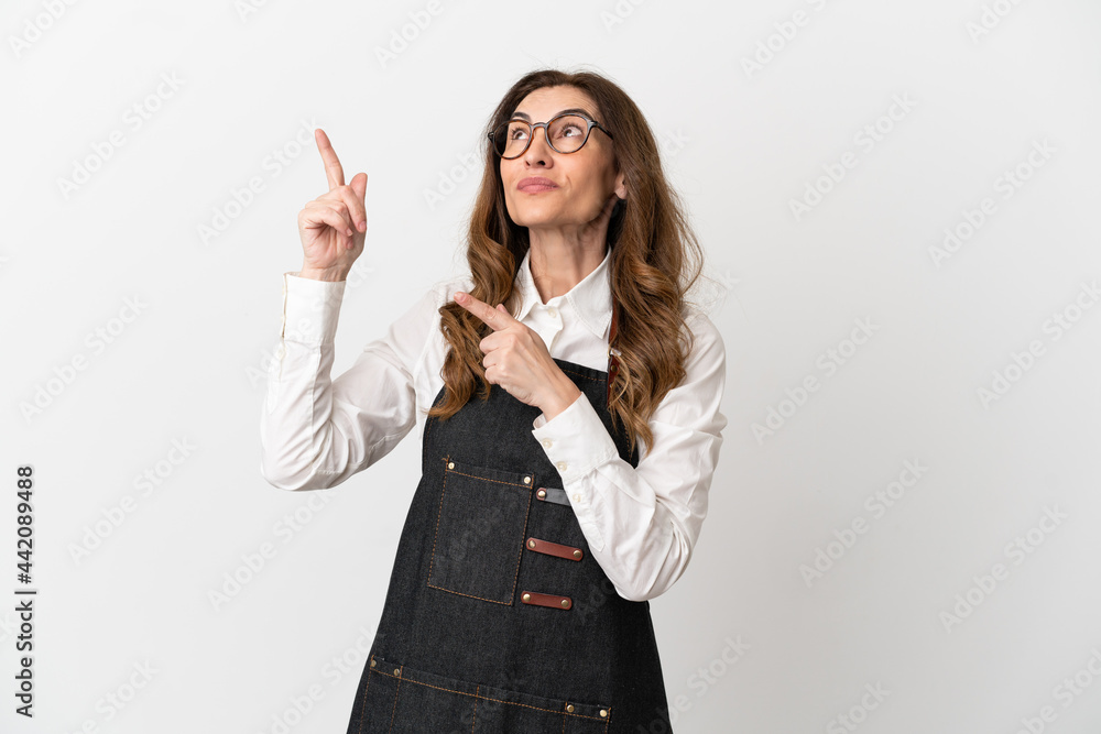 Restaurant middle aged waiter woman isolated on white background pointing with the index finger a great idea Restaurant middle aged waiter woman isolated on white background pointing with the index finger a great idea